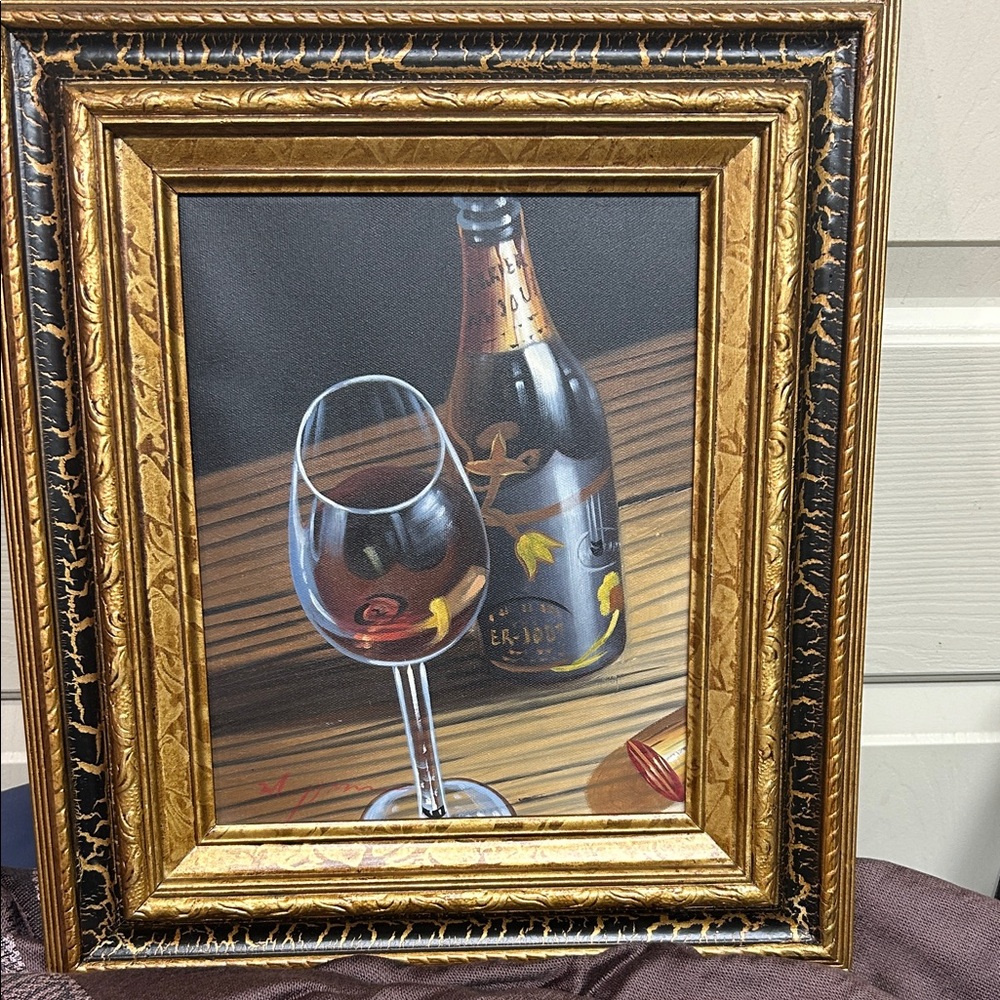 Oil painting a still life of a bottle of wine and a glass of red wine.